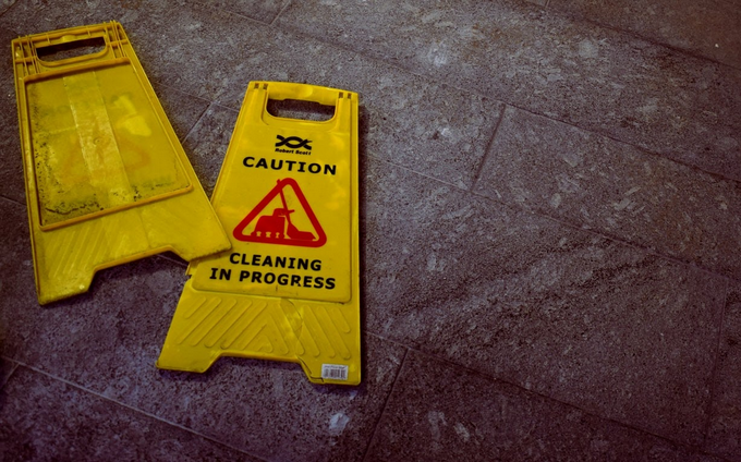caution signage lying on the floor